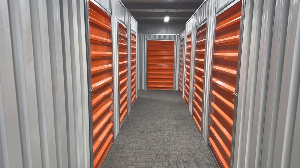 An indoor corridor of room doors