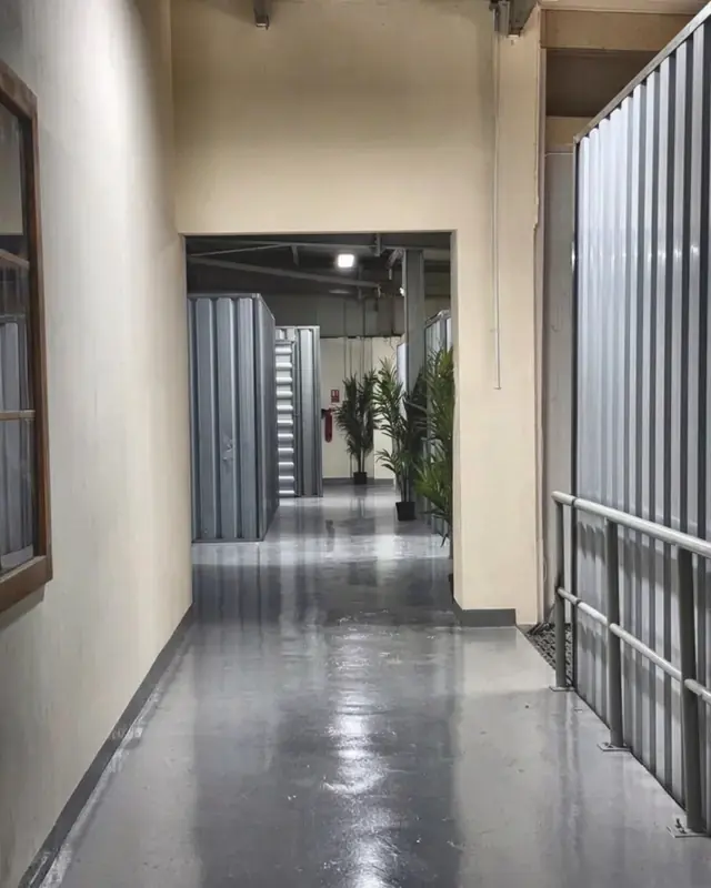 Clean, lit hallways between the rooms